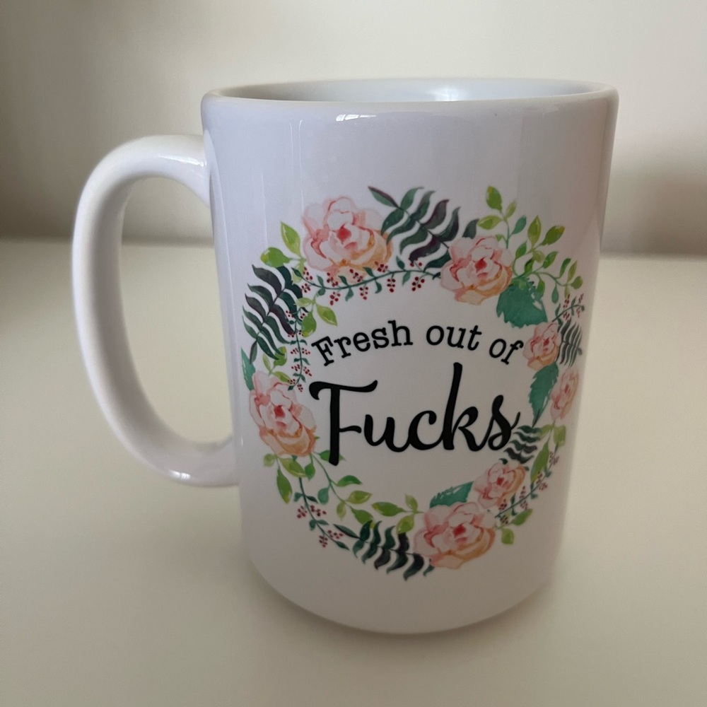 “Fresh out of fucks” floral mug